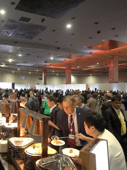 A shot of a busy buffet line at a large conference. Our team is experienced in managing high-volume service, ensuring that all guests are served efficiently without compromising on quality.