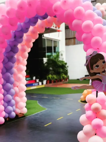 A beautiful rainbow balloon arch for a Ballerina-themed party. The graceful ballerina cutout adds a touch of elegance to the entrance.