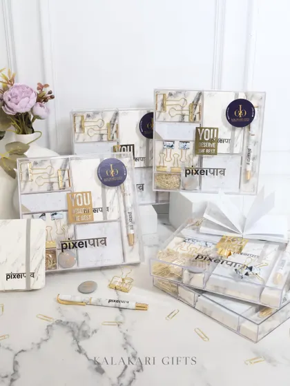 Another view of the bulk order of our "PixelPaav" stationery sets, some of which are wrapped with a white ribbon for gifting.