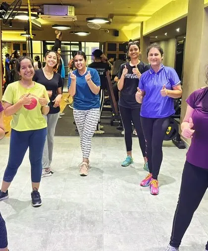 Thumbs up from the group after a great workout. The positive energy and encouragement from fellow members make every class something to look forward to.
