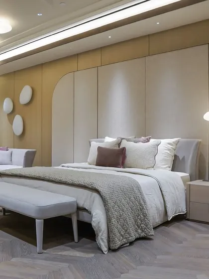 A client's bedroom, where our custom furniture and design transformed their vision into reality. The space features a light, airy feel with a custom bed, daybed, and bench.