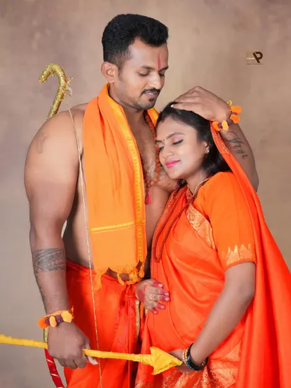 A loving embrace in our Seetha-Ram themed shoot. The costumes and props create a divine atmosphere, perfect for couples who want a unique and meaningful session.