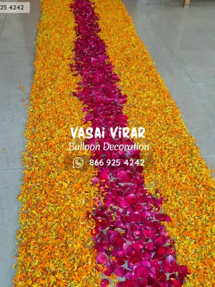 Here is a close-up view of the flower petal runner. I use fresh marigold and rose petals to create a thick, colorful carpet that makes the walk into the home feel like a truly special event.