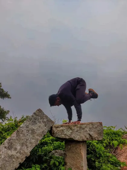 Bakasana (Crow Pose) on a rock at Skandagiri. Arm balances are not just about strength, but also about finding your center of gravity and trusting yourself.