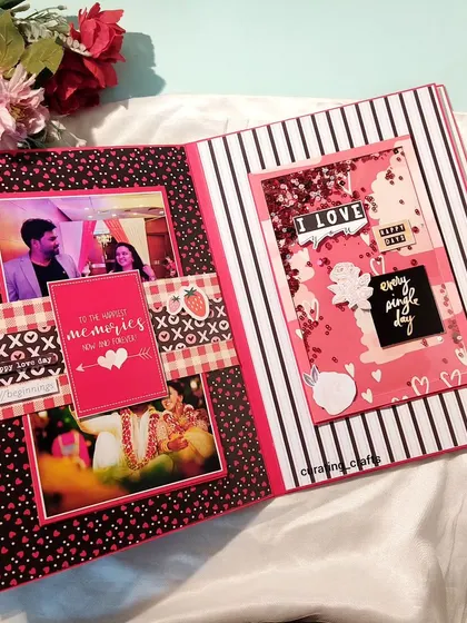 A modern black and white striped page from the anniversary album, featuring shaker elements and fun photo placements.