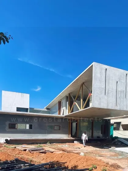 An under-construction shot of the Long House, revealing the raw power of the 23-foot cantilever before the finishing touches. This image showcases the ambitious structural engineering that underpins our designs.