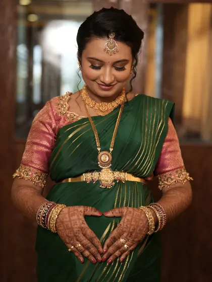 The beautiful mom-to-be, Sheetal, at her baby shower. I created a soft, traditional look to celebrate this special milestone, focusing on a radiant complexion and gentle features to match the joy of the occasion.