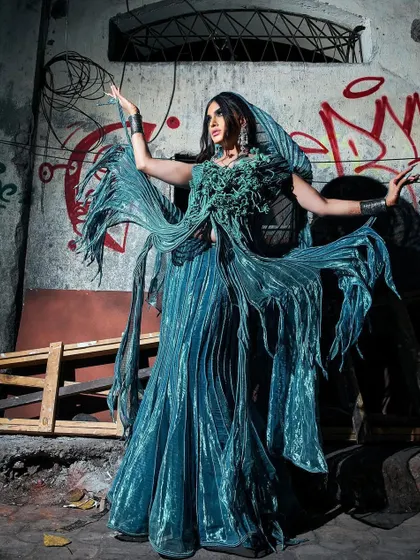 The full look in motion. The makeup for this shoot with Sushant Divgikr was about creating a sense of dark fantasy to match the graffiti-art background and the unique garment.