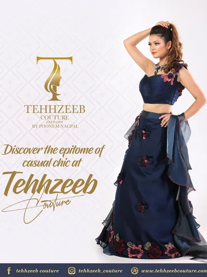 A stunning navy blue gown with intricate floral appliqué work. This piece is designed to be a showstopper at any event, from a wedding reception to a formal party.