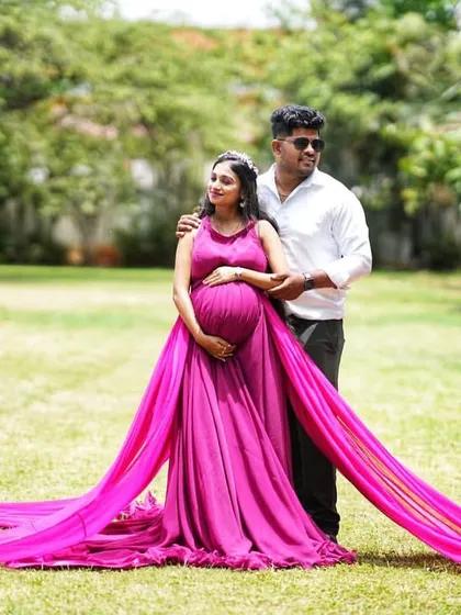 Another beautiful couple shot from a maternity shoot, with the magenta trail gown creating a romantic and dreamy feel.