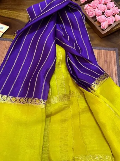 A striking purple and yellow wrinkle crepe Mysore silk saree.