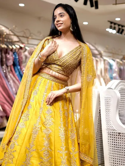 Brighten up the celebrations with this vibrant yellow lehenga. The rich color and delicate silver embroidery make it a perfect choice for a Haldi or Mehendi ceremony.