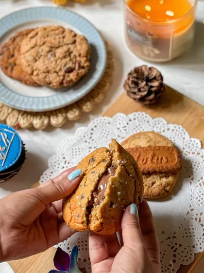 A box of four gourmet chunk cookies for Father's Day, with flavors like Biscoff, Nutella Sea Salt, and a sugar-free oatmeal option. It's the perfect treat to share with Dad over coffee.