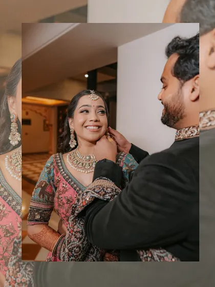 A sweet, candid moment as the groom helps the bride with her jewelry, her smile reflecting their easy and affectionate connection.
