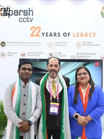 My leadership team at the IndiaSoft & Convergence 2025 booth, standing proud next to our '22 Years of Legacy' display.