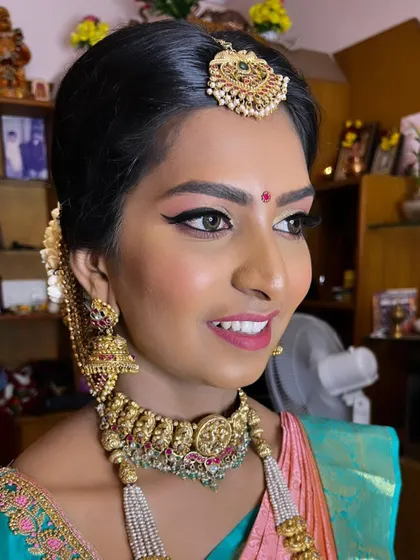 A radiant smile from my lovely bride on her wedding day. This profile view highlights the clean lines of her winged eyeliner and the smooth, natural-looking skin finish that lasts all day.