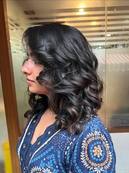 A side view of the tousled long bob.