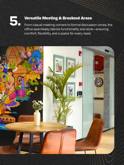A versatile meeting and breakout area at VentureX IFFCO Chowk. A casual meeting corner with a vibrant mural is shown, demonstrating how we blend functionality with style to ensure a space for every need.