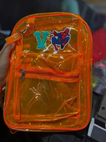 A Spiderman fan got his backpack customized with a 'V' initial and a Spidey patch.