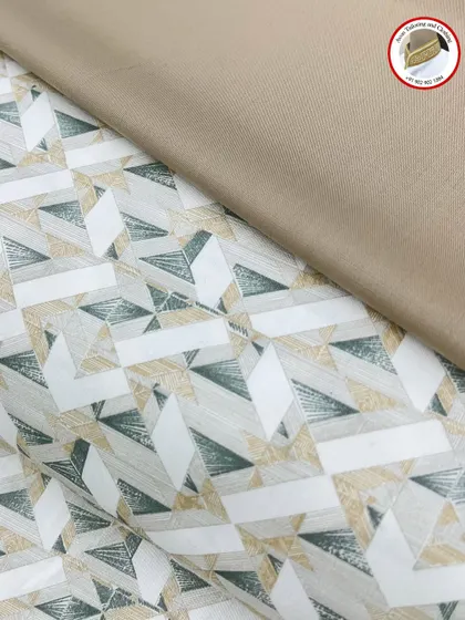 This geometric print fabric is shown with a matching plain fabric for the izaar. This combination creates a coordinated and stylish kurta izaar set.