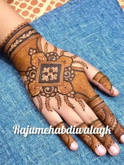 This design focuses on a central square mandala, which is a bit more modern and geometric. The detailed finger work and wrist cuff make it feel complete.