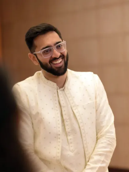 A candid portrait of the groom, capturing his genuine smile and happiness during the Roka ceremony.