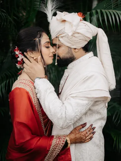 A tender and romantic close-up of the couple, their faces close together in an embrace.