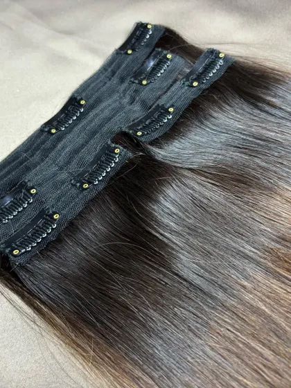 Another angle of a premium clip-on set, showing the dark roots blending into lighter ends for a natural ombre effect.