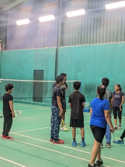 Players getting organized and listening to instructions during a break in the match day action.