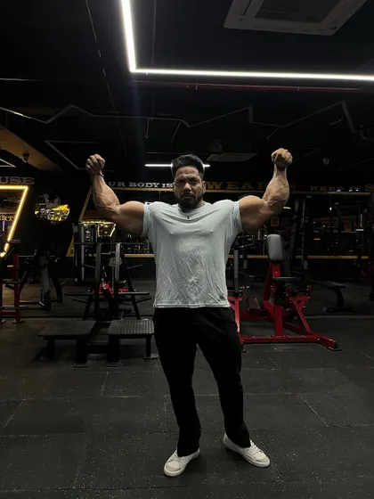 A front double bicep pose. Dreams without action is just sleep.