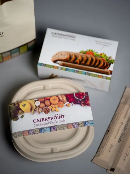 Our meals are packed with care to ensure they reach you fresh and delicious. This image shows our eco-friendly packaging, ready for a journey to your doorstep.