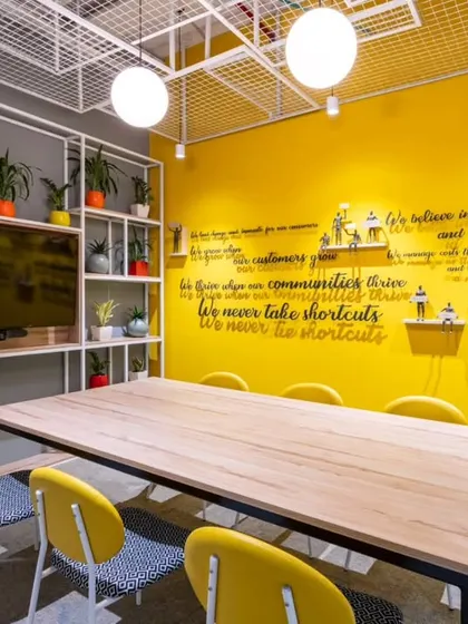 Even meeting rooms can be inspiring. For this space at AbInbev, we used a bright yellow accent wall and incorporated the company's values as a 3D typographic installation, reminding the team of their mission.