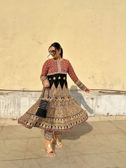 A twirl in this magnificent Anarkali shows off the incredible detail and craftsmanship in the printed fabric.