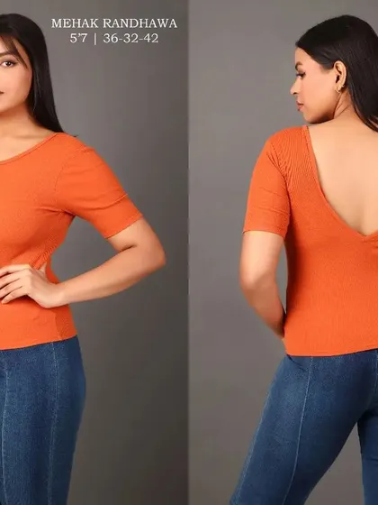 To fully display a garment's features, I capture both front and back views. This image set for a plus-size model shows an orange top with a distinctive V-shaped back, providing essential details for online buyers.