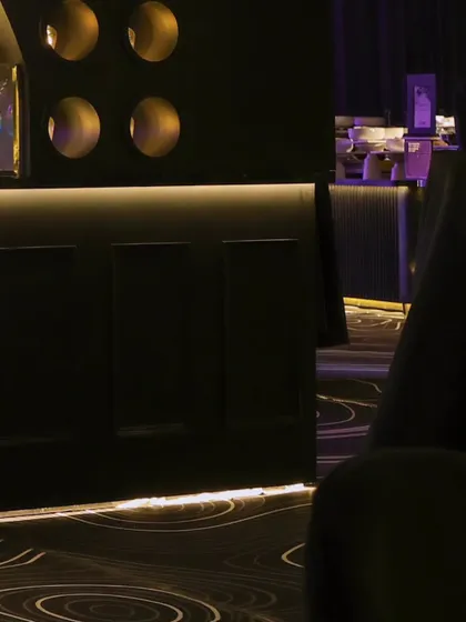 A view from a guest's perspective, showing the sleek bar and seating area, designed for comfort and style.