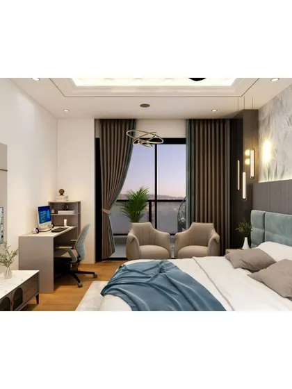 This bedroom is designed to be a multi-functional space, with a dedicated work desk and a comfortable seating area by the balcony. It’s a perfect setup for a modern lifestyle.