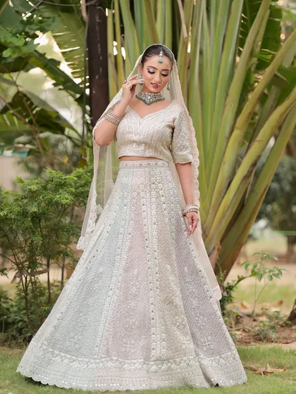 Another angle of this graceful bride. The makeup is flawless from every side, ensuring she looks perfect in all her wedding photos.