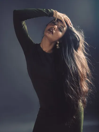 Creating a sense of movement and freedom in the studio. The flowing hair adds a dynamic, ethereal quality to the portrait.