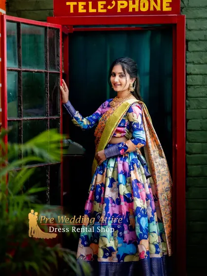 For a fun and quirky look, I offer this printed lehenga with a colorful, modern pattern. It's paired with a full-sleeve blouse and a contrasting dupatta.