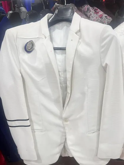 This trendy white blazer with black sleeve stripes is a modern and fashionable option from our men's collection.