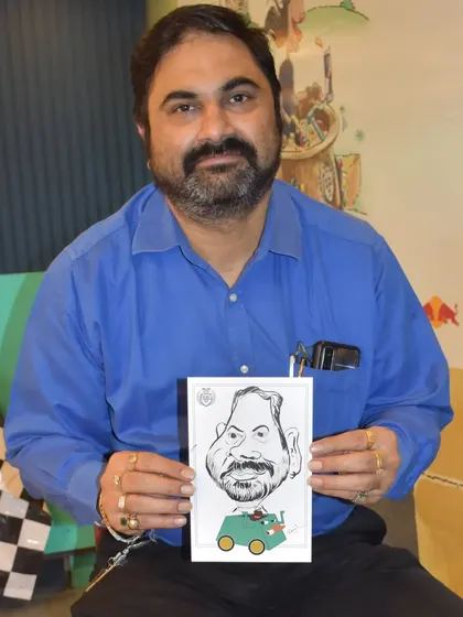 Capturing the likeness of employees is a fun challenge. This gentleman seems pleased with his portrait.