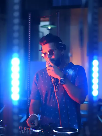 On the mic, connecting with the crowd. Music is a universal language.