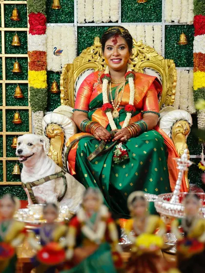 Capturing the grandeur of a traditional baby shower ceremony. This shot shows the mother-to-be seated like a queen, surrounded by tradition, family, and even the family pet, all part of the celebration.