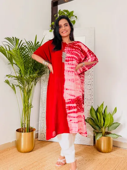 This red kaftan with a tie-dye panel is a bold and stylish choice. It's a comfortable yet statement-making piece.