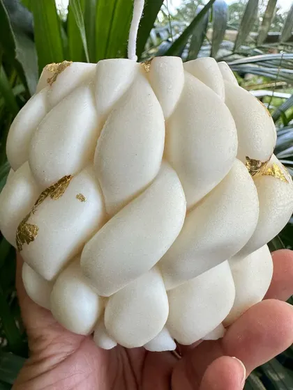 My gold-foiled braided soy candle is a modern, sculptural piece that adds a touch of elegance to any setting. The intricate braided texture is highlighted with delicate gold leaf, making it a beautiful decorative accent or a sophisticated gift.