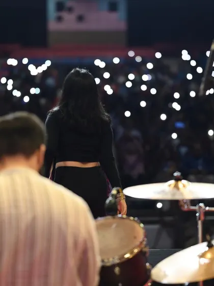 A view from the stage, looking out at a sea of phone lights during a slow song. These are the magical moments that make live music so powerful.