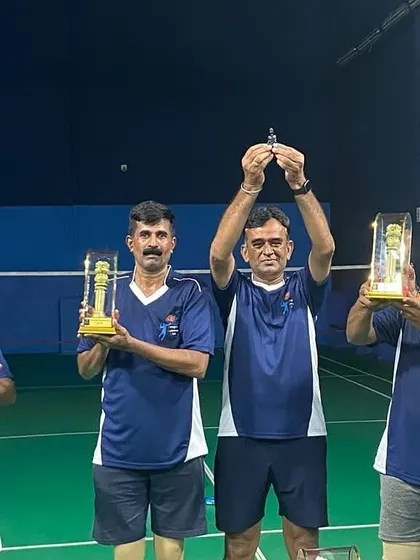 Hoisting the trophies high after a successful tournament.