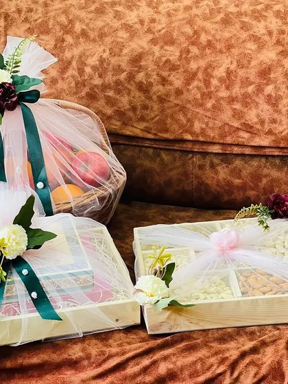Here you can see the variety in a single trousseau project, including a large fruit basket, a compartmentalized dry fruit box, and other gift boxes. Each is wrapped to complement the others.