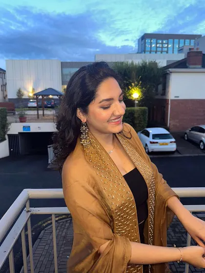 A versatile piece for any wardrobe. This client looks radiant wearing our gold French chiffon hand-embroidered cape, which can be paired with both Indian and Western outfits.