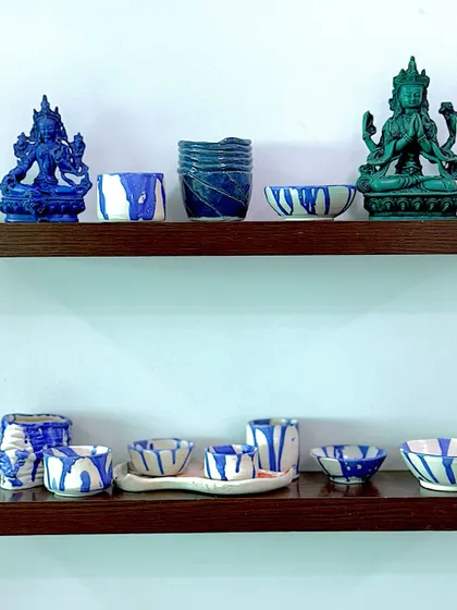 My finished ceramic pieces, finding their place on the shelf at home. Seeing them alongside other meaningful objects reminds me of the joy found in learning and creating with my hands.